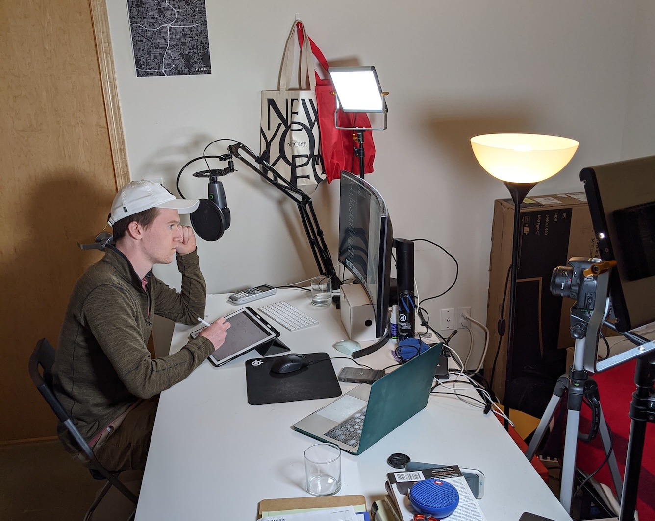 Photo of author working at a desk in his college apartment during the Covid-19 Pandemic